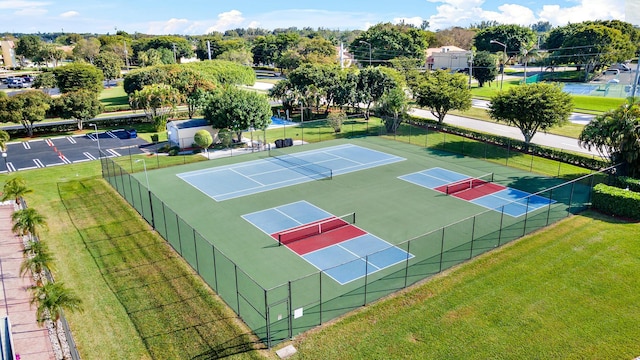 exterior space featuring a yard and tennis court