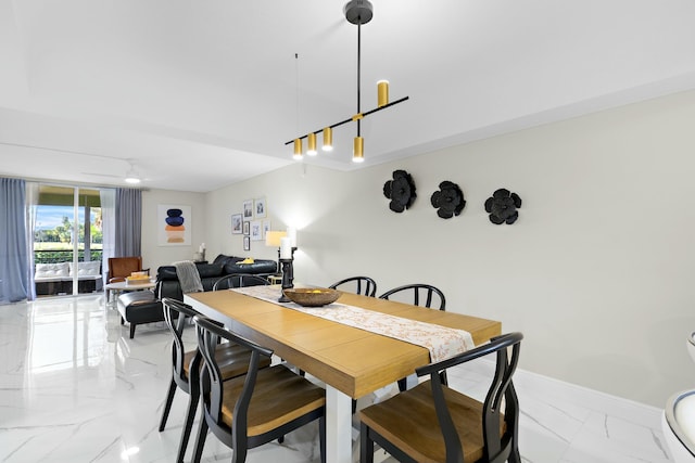 dining space with ceiling fan