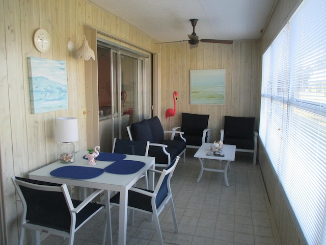 sunroom featuring a ceiling fan