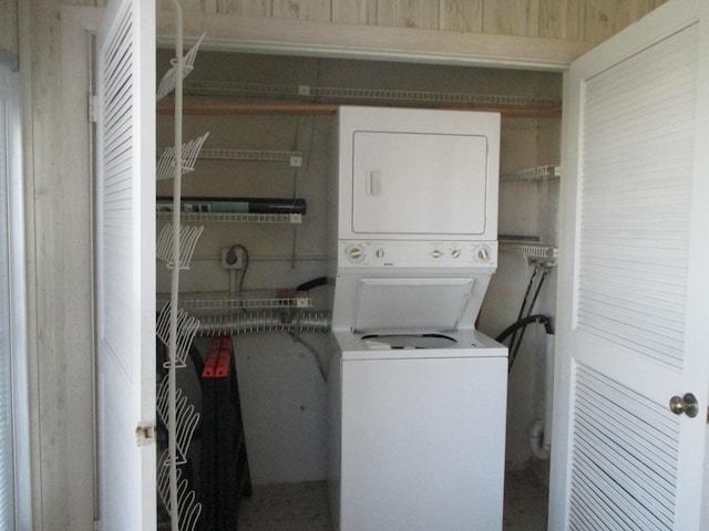 laundry room featuring laundry area and stacked washer and dryer