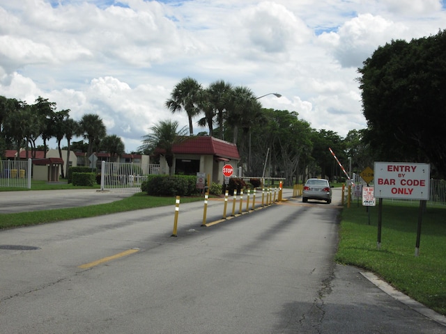 view of road with traffic signs and street lights