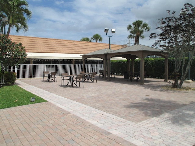 view of community with fence and a gazebo