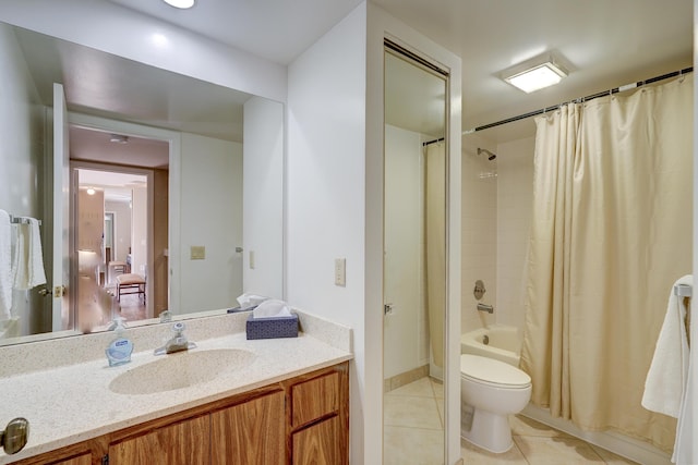 full bathroom with vanity, tile patterned floors, shower / bath combination with curtain, and toilet