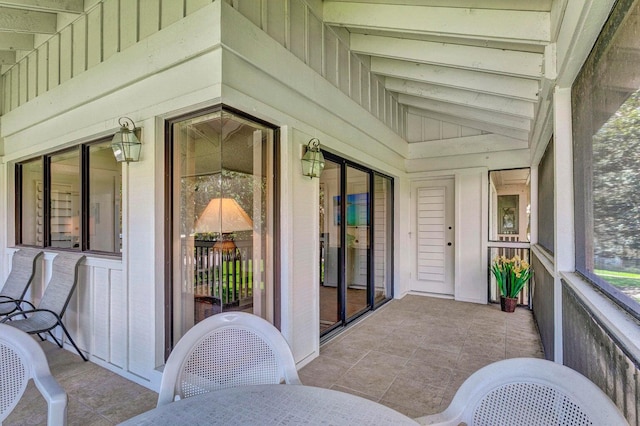 sunroom with lofted ceiling