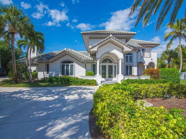 mediterranean / spanish house featuring french doors