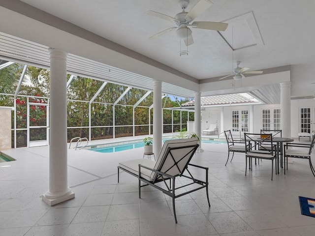 view of pool with a patio, a lanai, ceiling fan, and french doors