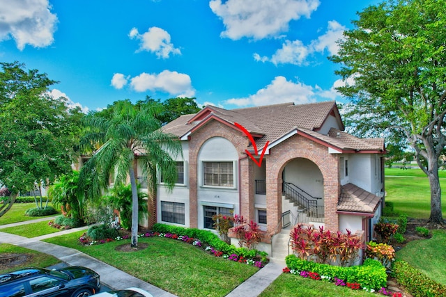 view of front of home with a front yard