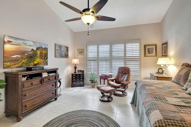 tiled bedroom with vaulted ceiling and ceiling fan