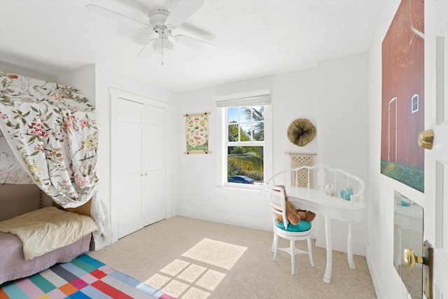 interior space featuring ceiling fan and carpet