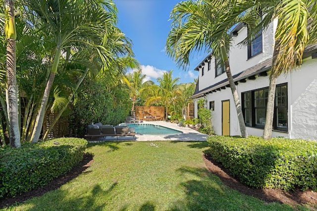 view of yard featuring pool water feature and a patio area