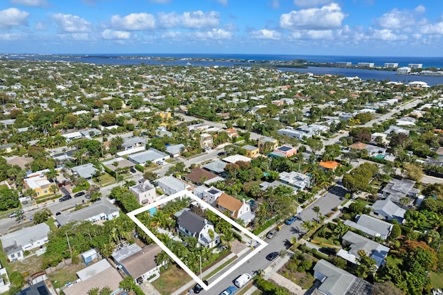 birds eye view of property featuring a water view