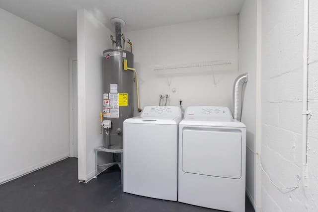 laundry room with washer and clothes dryer and gas water heater