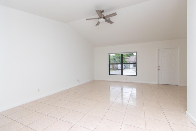 unfurnished room featuring light tile patterned flooring, vaulted ceiling, and ceiling fan