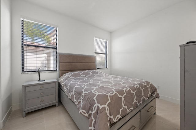 bedroom with light tile patterned flooring