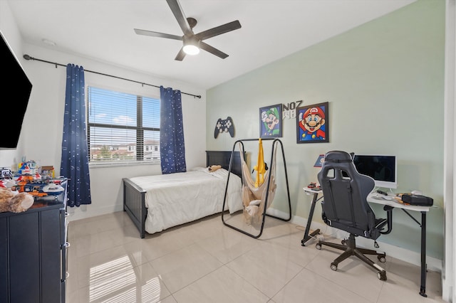 tiled bedroom with ceiling fan