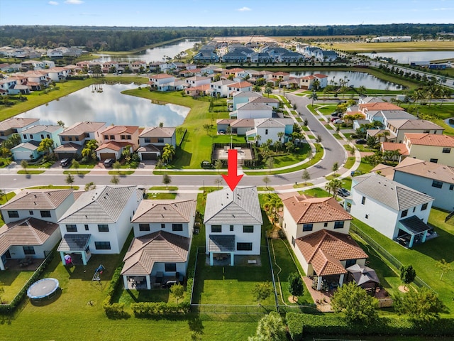 birds eye view of property featuring a water view