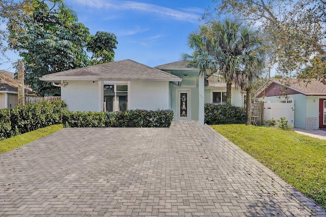 ranch-style house with a front yard