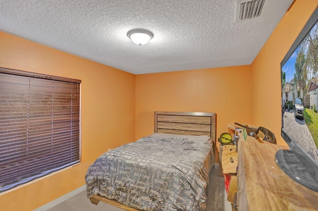 bedroom featuring a textured ceiling