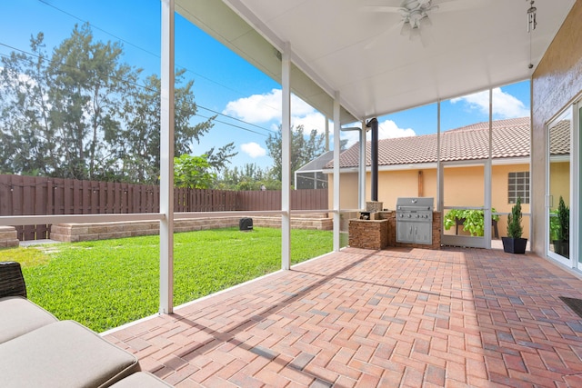 unfurnished sunroom featuring ceiling fan