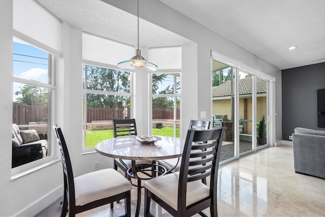 sunroom featuring plenty of natural light