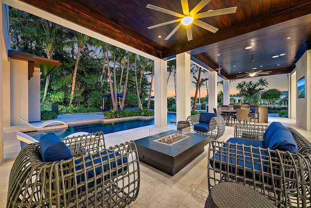 177 Commodore Dr, Jupiter, FL 33477 - view of patio / terrace featuring a ceiling fan, an outdoor living space with a fire pit, an outdoor pool, and a bar