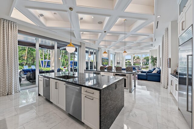 kitchen with dark brown cabinetry, wine cooler, dark stone countertops, and tasteful backsplash