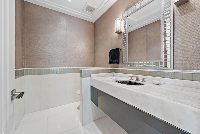 bathroom featuring tile patterned flooring, visible vents, toilet, and vanity