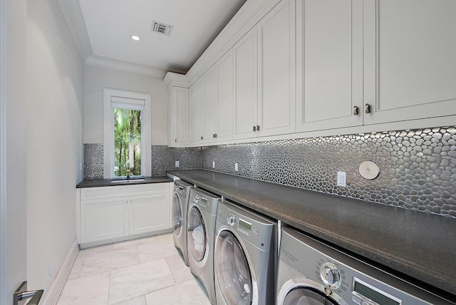 laundry room with recessed lighting, visible vents, cabinet space, and separate washer and dryer