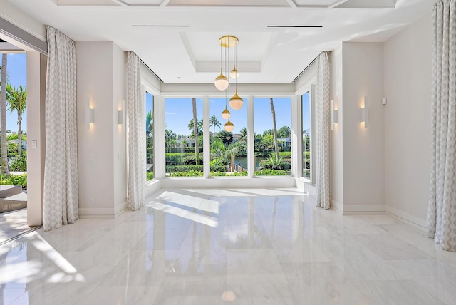177 Commodore Dr, Jupiter, FL 33477 - unfurnished room featuring plenty of natural light, marble tiled flooring, and a tray ceiling