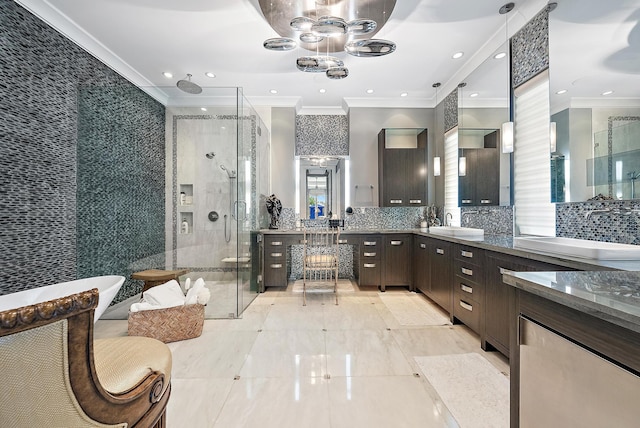 full bath featuring ornamental molding, tile walls, a shower stall, decorative backsplash, and vanity