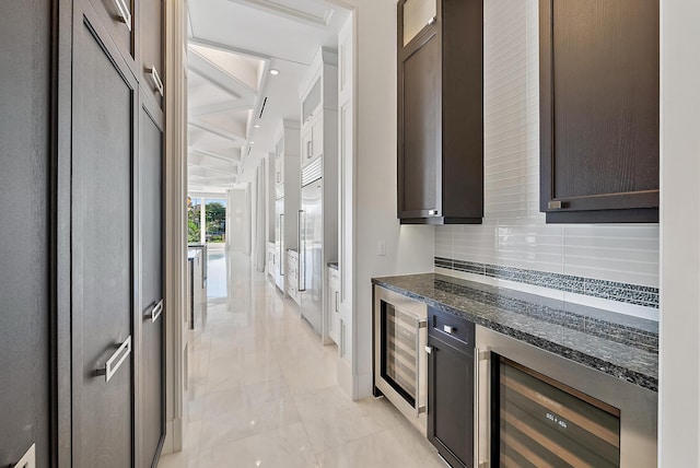 177 Commodore Dr, Jupiter, FL 33477 - bar area featuring beverage cooler, coffered ceiling, tasteful backsplash, light marble finish flooring, and stainless steel built in fridge
