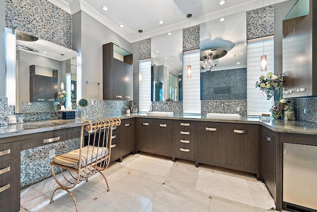 full bath featuring recessed lighting, backsplash, ornamental molding, and vanity