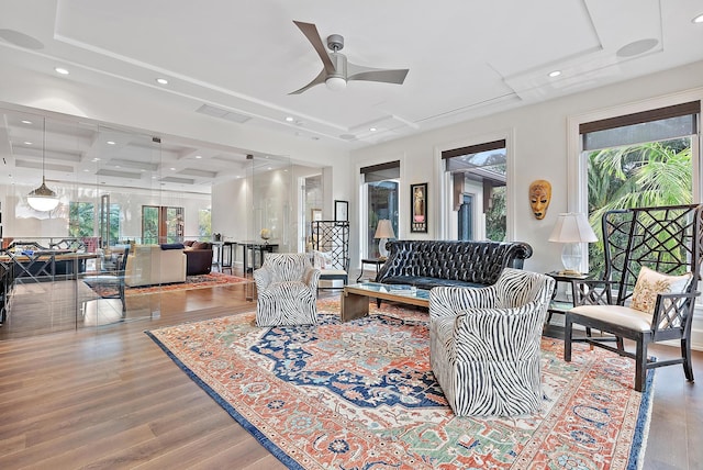 living room featuring wood finished floors, visible vents, coffered ceiling, recessed lighting, and ceiling fan