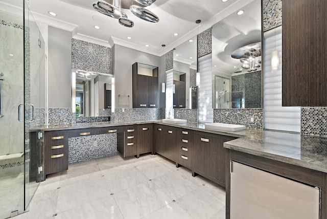 177 Commodore Dr, Jupiter, FL 33477 - bathroom with crown molding, backsplash, a chandelier, a shower stall, and vanity
