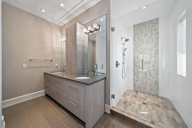 177 Commodore Dr, Jupiter, FL 33477 - bathroom featuring tile patterned flooring, a tile shower, double vanity, baseboards, and recessed lighting