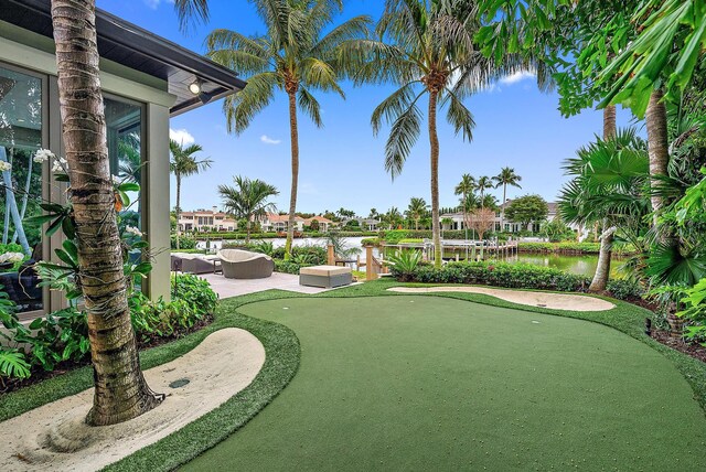 view of patio with an outdoor pool, an outdoor living space with a fire pit, outdoor dining area, and ceiling fan