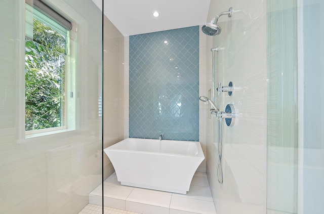 177 Commodore Dr, Jupiter, FL 33477 - bathroom featuring tile patterned floors, a tile shower, and a freestanding bath