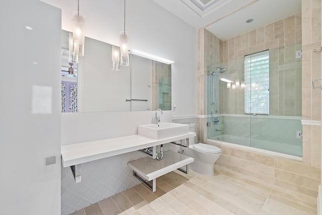 177 Commodore Dr, Jupiter, FL 33477 - full bathroom featuring tiled shower / bath combo, toilet, and a sink