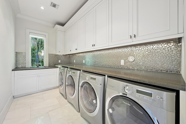 177 Commodore Dr, Jupiter, FL 33477 - laundry area featuring washing machine and dryer and cabinet space