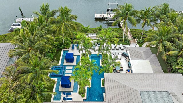 wooden terrace with a residential view, an outdoor hangout area, a dock, and a water view