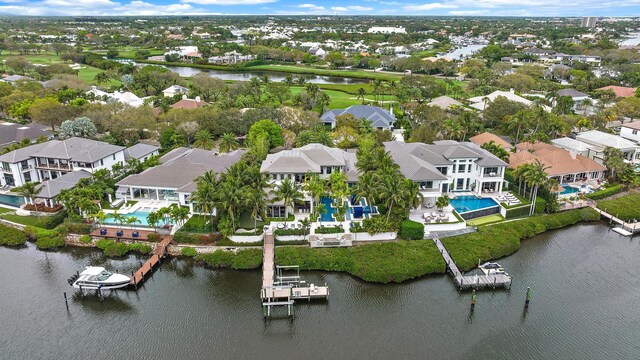 back of house with a tile roof, a patio, fence, a sunroom, and an outdoor pool