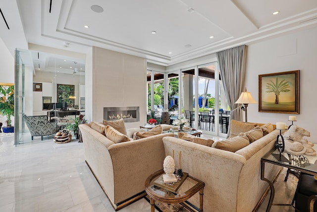 living area featuring a tiled fireplace, recessed lighting, a raised ceiling, and a towering ceiling