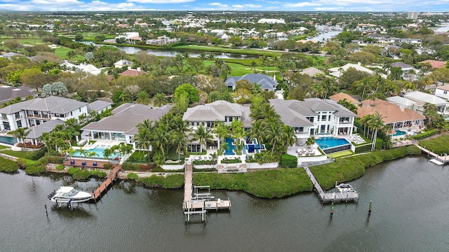 bird's eye view featuring a residential view and a water view