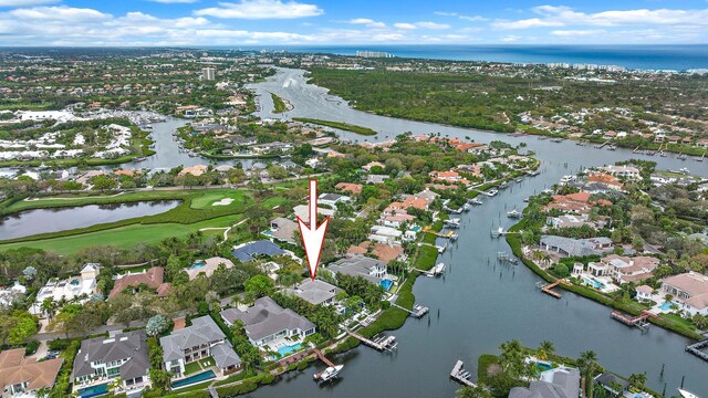 birds eye view of property featuring a water view and a residential view