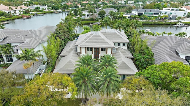 drone / aerial view with a residential view and a water view