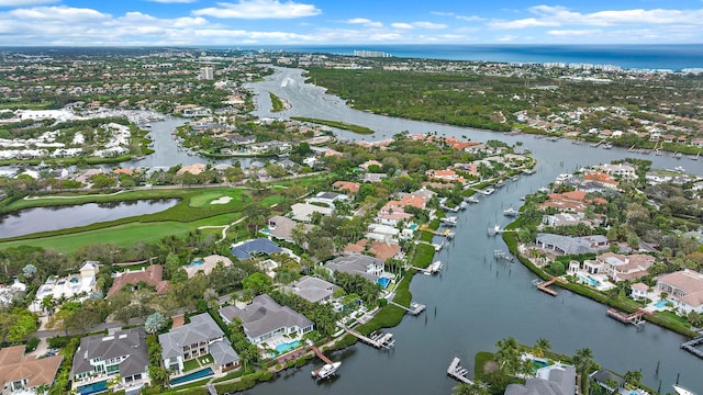 birds eye view of property featuring a water view and a residential view