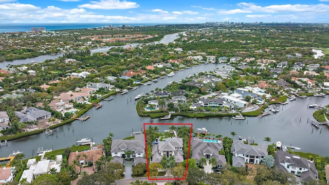 birds eye view of property with a residential view and a water view