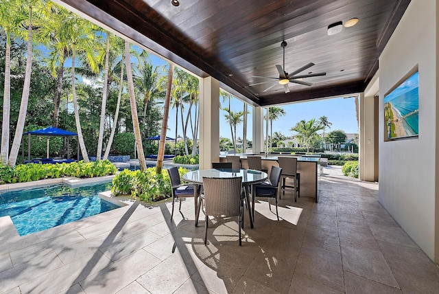 177 Commodore Dr, Jupiter, FL 33477 - view of patio featuring ceiling fan, an outdoor pool, and outdoor dining space