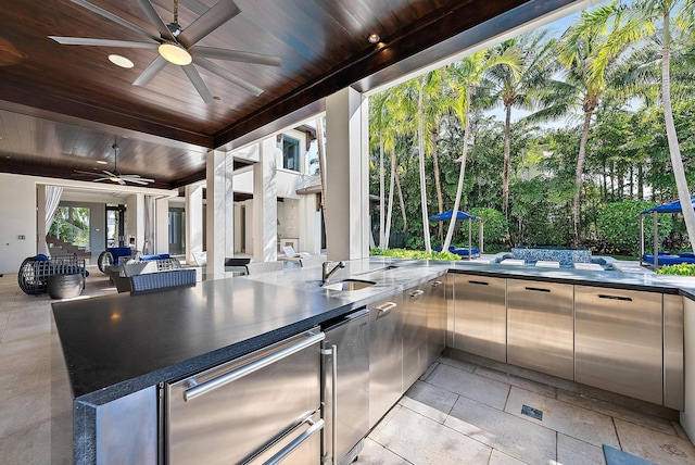 177 Commodore Dr, Jupiter, FL 33477 - view of patio featuring a ceiling fan and an outdoor kitchen
