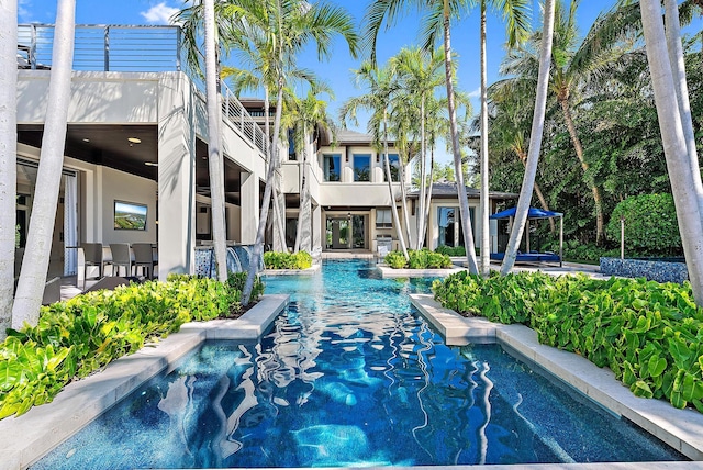 177 Commodore Dr, Jupiter, FL 33477 - swimming pool featuring a patio